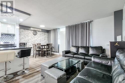 402 - 1950 Kennedy Road, Toronto, ON - Indoor Photo Showing Living Room