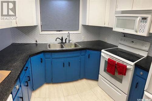 1224 Walker Street, Swift Current, SK - Indoor Photo Showing Kitchen With Double Sink