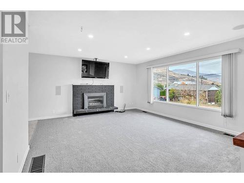 1074 Ollek Street, Kamloops, BC - Indoor Photo Showing Living Room With Fireplace