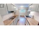 2117 2Nd Street N Unit# 102, Cranbrook, BC  - Indoor Photo Showing Kitchen With Double Sink 