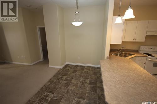 204 1901 Victoria Avenue, Regina, SK - Indoor Photo Showing Kitchen With Double Sink