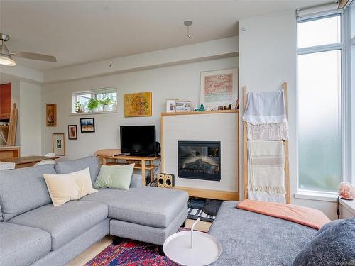 303-365 Waterfront Cres, Victoria, BC - Indoor Photo Showing Living Room With Fireplace