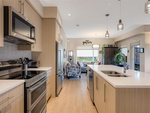 104-2500 Hackett Cres, Central Saanich, BC - Indoor Photo Showing Kitchen With Stainless Steel Kitchen With Double Sink With Upgraded Kitchen