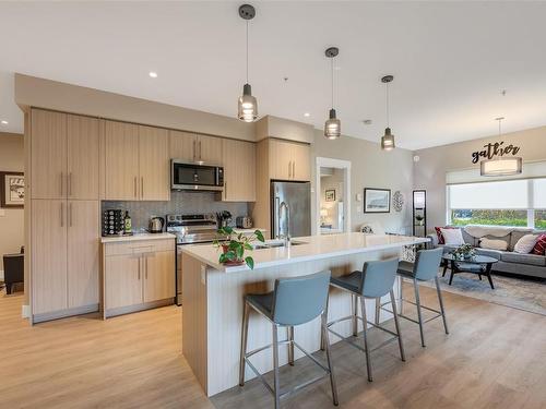 104-2500 Hackett Cres, Central Saanich, BC - Indoor Photo Showing Kitchen With Stainless Steel Kitchen With Double Sink With Upgraded Kitchen