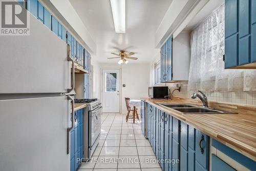 414 Odlum Drive, Woodstock, ON - Indoor Photo Showing Kitchen With Double Sink