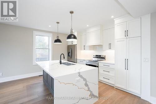 9 Bertram Drive, Springwater, ON - Indoor Photo Showing Kitchen With Double Sink With Upgraded Kitchen