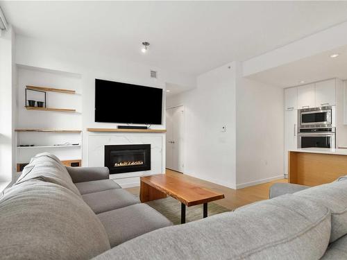 504-4009 Rainbow Hill Lane, Saanich, BC - Indoor Photo Showing Living Room With Fireplace