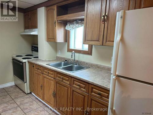 23-25 Aura Lake Street, Timmins (Main Area), ON - Indoor Photo Showing Kitchen With Double Sink