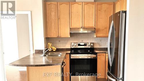 307 - 11121 Yonge Street, Richmond Hill, ON - Indoor Photo Showing Kitchen With Double Sink