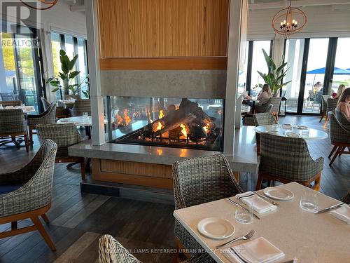 203 - 415 Sea Ray Avenue, Innisfil, ON - Indoor Photo Showing Living Room With Fireplace