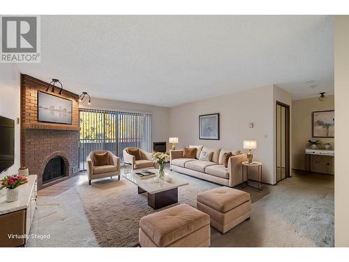 983 Bernard Avenue Unit# 201, Kelowna, BC - Indoor Photo Showing Living Room With Fireplace