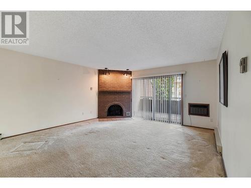 983 Bernard Avenue Unit# 201, Kelowna, BC - Indoor With Fireplace