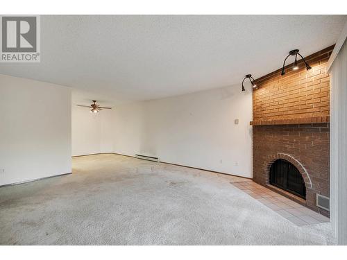 983 Bernard Avenue Unit# 201, Kelowna, BC - Indoor With Fireplace