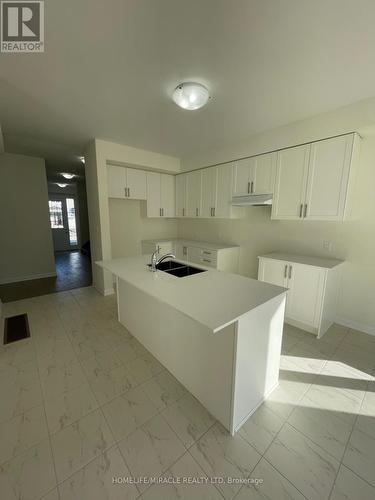 91 Oakmont Drive, Loyalist, ON - Indoor Photo Showing Kitchen With Double Sink