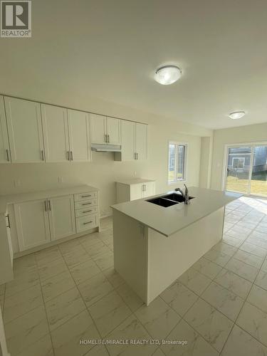 91 Oakmont Drive, Loyalist, ON - Indoor Photo Showing Kitchen With Double Sink