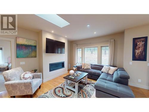 145 The Whins, Cranbrook, BC - Indoor Photo Showing Living Room With Fireplace