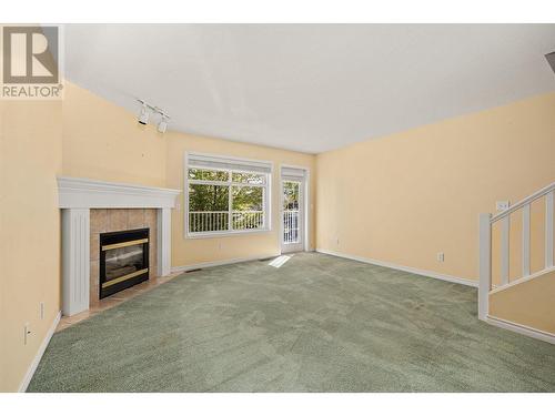 3825 Glen Canyon Drive Unit# 105, West Kelowna, BC - Indoor With Fireplace