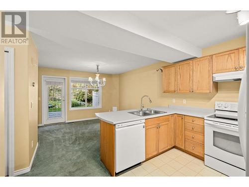 3825 Glen Canyon Drive Unit# 105, West Kelowna, BC - Indoor Photo Showing Kitchen With Double Sink