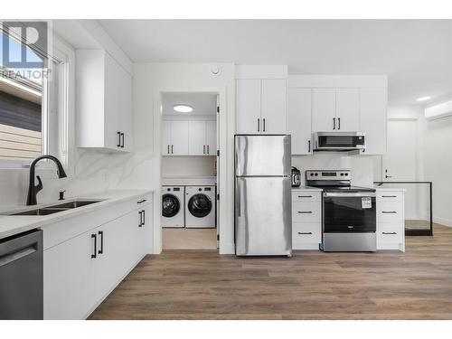 411 Vision Court, Kelowna, BC - Indoor Photo Showing Kitchen With Stainless Steel Kitchen With Double Sink