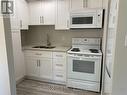 4 - 2 Village Drive, Belleville, ON  - Indoor Photo Showing Kitchen With Double Sink 