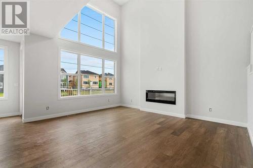 107 Chelsea Channel, Chestermere, AB - Indoor Photo Showing Living Room With Fireplace