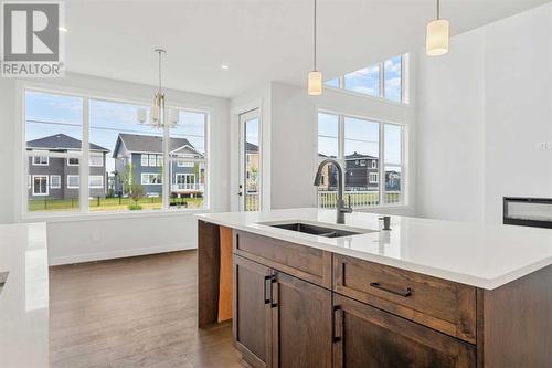 107 Chelsea Channel, Chestermere, AB - Indoor Photo Showing Kitchen With Double Sink With Upgraded Kitchen