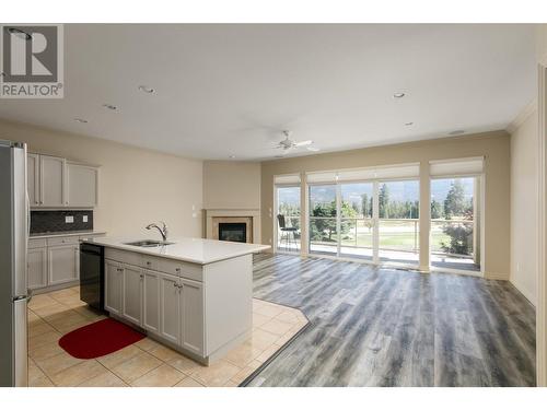 2286 Country Club Drive, Kelowna, BC - Indoor Photo Showing Kitchen With Fireplace