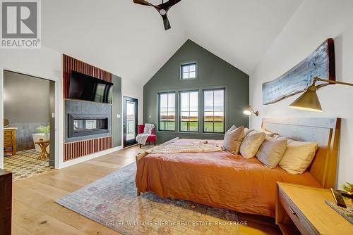 551 Shannon Road, Prince Edward County (Hallowell), ON - Indoor Photo Showing Bedroom With Fireplace