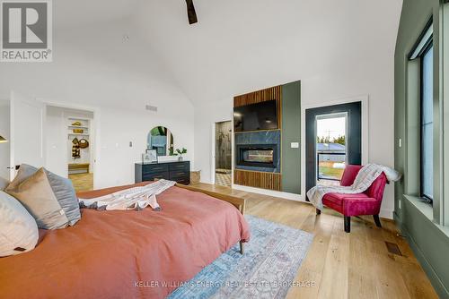 551 Shannon Road, Prince Edward County (Hallowell), ON - Indoor Photo Showing Bedroom With Fireplace