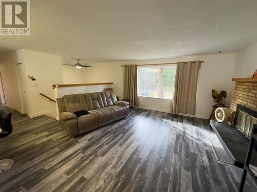 5003 Smith Road, 108 Mile Ranch, BC - Indoor Photo Showing Living Room With Fireplace