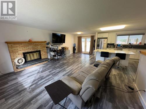 5003 Smith Road, 108 Mile Ranch, BC - Indoor Photo Showing Living Room With Fireplace