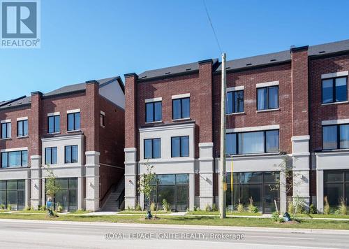 16 - 220 Dissette Street, Bradford West Gwillimbury, ON -  With Facade