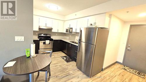 2718 - 258 B Sunview Street, Waterloo, ON - Indoor Photo Showing Kitchen With Stainless Steel Kitchen