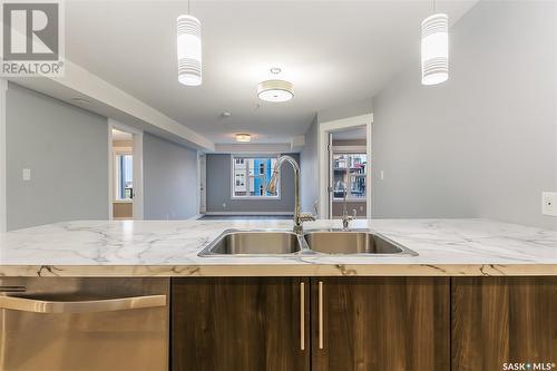 322 5301 Universal Crescent, Regina, SK - Indoor Photo Showing Kitchen With Double Sink