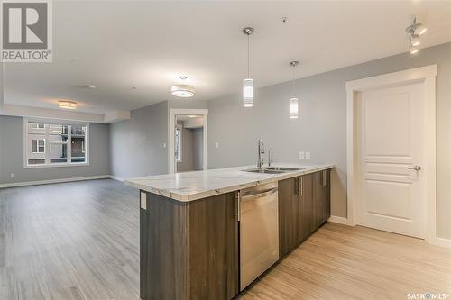 322 5301 Universal Crescent, Regina, SK - Indoor Photo Showing Kitchen With Double Sink