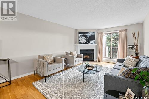 304 130 Edinburgh Place, Saskatoon, SK - Indoor Photo Showing Living Room With Fireplace