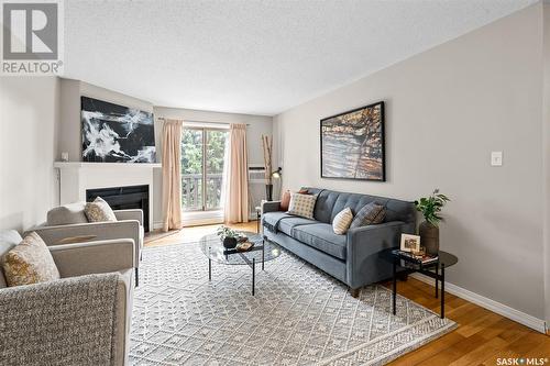 304 130 Edinburgh Place, Saskatoon, SK - Indoor Photo Showing Living Room With Fireplace