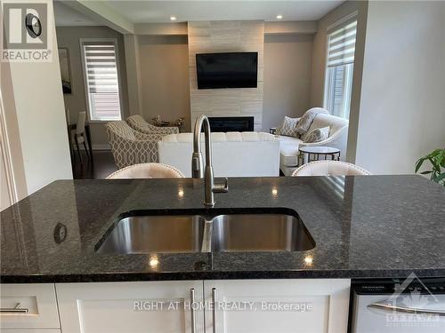 232 Saddleback Crescent, Ottawa, ON - Indoor Photo Showing Kitchen With Fireplace With Double Sink