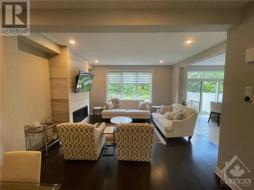 232 Saddleback Crescent, Ottawa, ON - Indoor Photo Showing Living Room With Fireplace