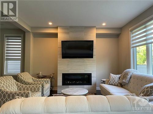 232 Saddleback Crescent, Ottawa, ON - Indoor Photo Showing Living Room With Fireplace