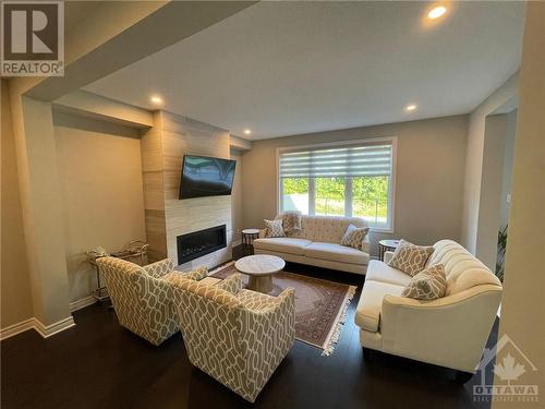 232 Saddleback Crescent, Ottawa, ON - Indoor Photo Showing Living Room With Fireplace