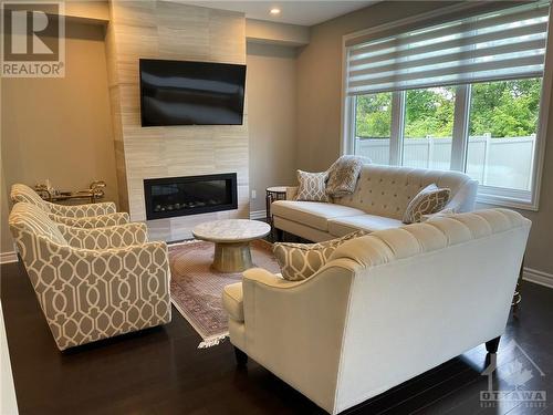 232 Saddleback Crescent, Ottawa, ON - Indoor Photo Showing Living Room With Fireplace