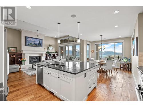 900 Lamont Lane, Kelowna, BC - Indoor Photo Showing Kitchen With Fireplace With Double Sink With Upgraded Kitchen