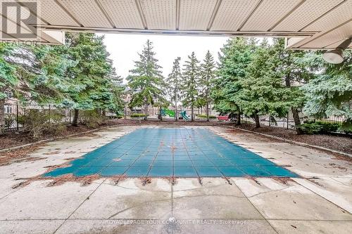 233 - 65 Bristol Road E, Mississauga, ON - Outdoor With In Ground Pool