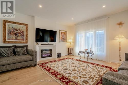 19 - 8974 Willoughby Drive, Niagara Falls, ON - Indoor Photo Showing Living Room With Fireplace