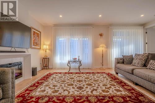 19 - 8974 Willoughby Drive, Niagara Falls, ON - Indoor Photo Showing Living Room With Fireplace