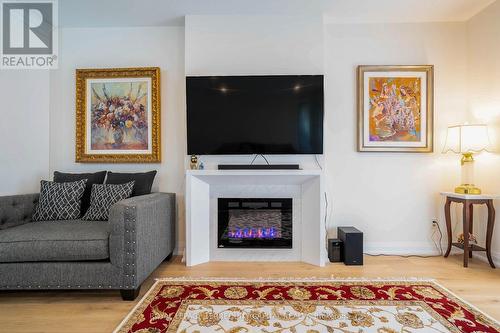 19 - 8974 Willoughby Drive, Niagara Falls, ON - Indoor Photo Showing Living Room With Fireplace