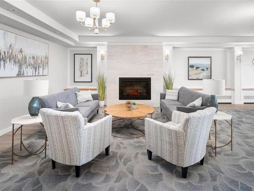 403-2910 Cook St, Victoria, BC - Indoor Photo Showing Living Room With Fireplace