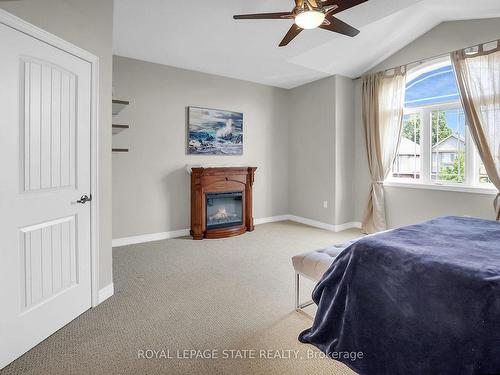 4896 Allan Crt, Lincoln, ON - Indoor Photo Showing Bedroom With Fireplace