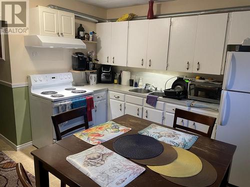 1175-1179 Raymer Avenue, Kelowna, BC - Indoor Photo Showing Kitchen With Double Sink